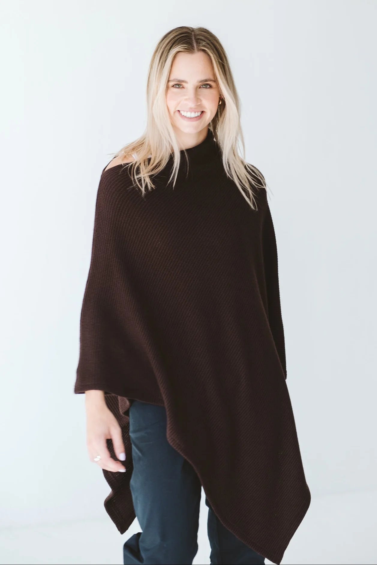 Trinity chocolate poncho made in South Africa, cozy and stylish outerwear accessory for cold weather, comfortable winter fashion.