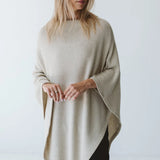 Cream Trinity poncho from consignment, cozy and comfortable, made in South Africa, ideal for cold weather and layered outerwear.