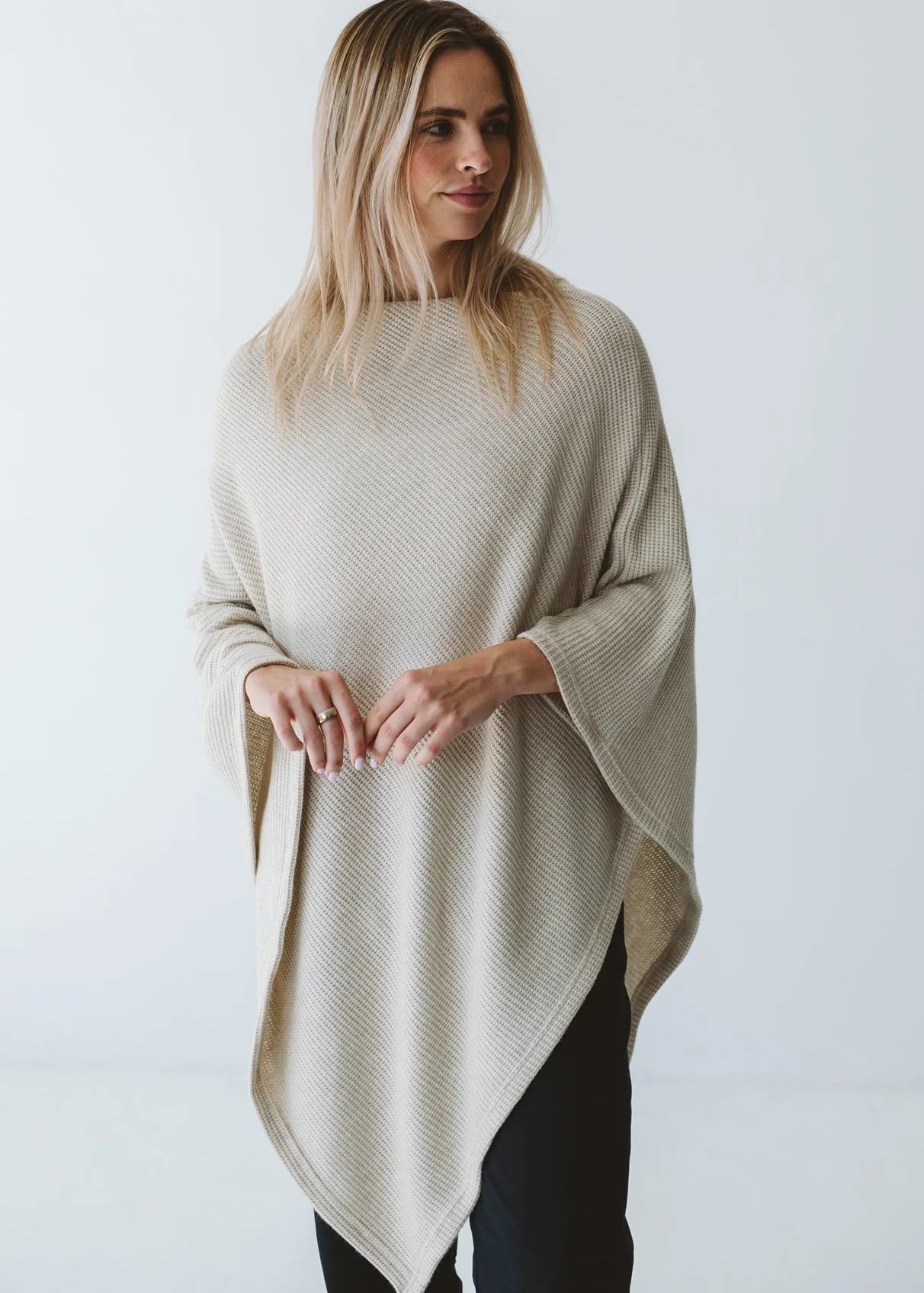 Cream Trinity poncho from consignment, cozy and comfortable, made in South Africa, ideal for cold weather and layered outerwear.