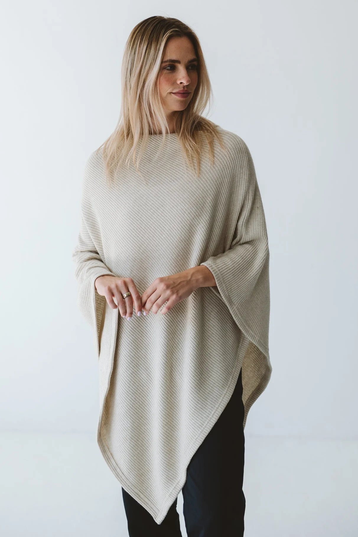 Cream Trinity poncho from consignment, cozy and comfortable, made in South Africa, ideal for cold weather and layered outerwear.
