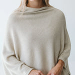 Cream Trinity poncho from consignment, cozy and stylish outerwear accessory made in South Africa, perfect for cold weather comfort.