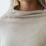 Cream Trinity poncho, cozy and stylish winter accessory, made in South Africa, perfect for cold weather outerwear.