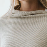 Cream Trinity poncho, cozy and stylish winter accessory, made in South Africa, perfect for cold weather outerwear.