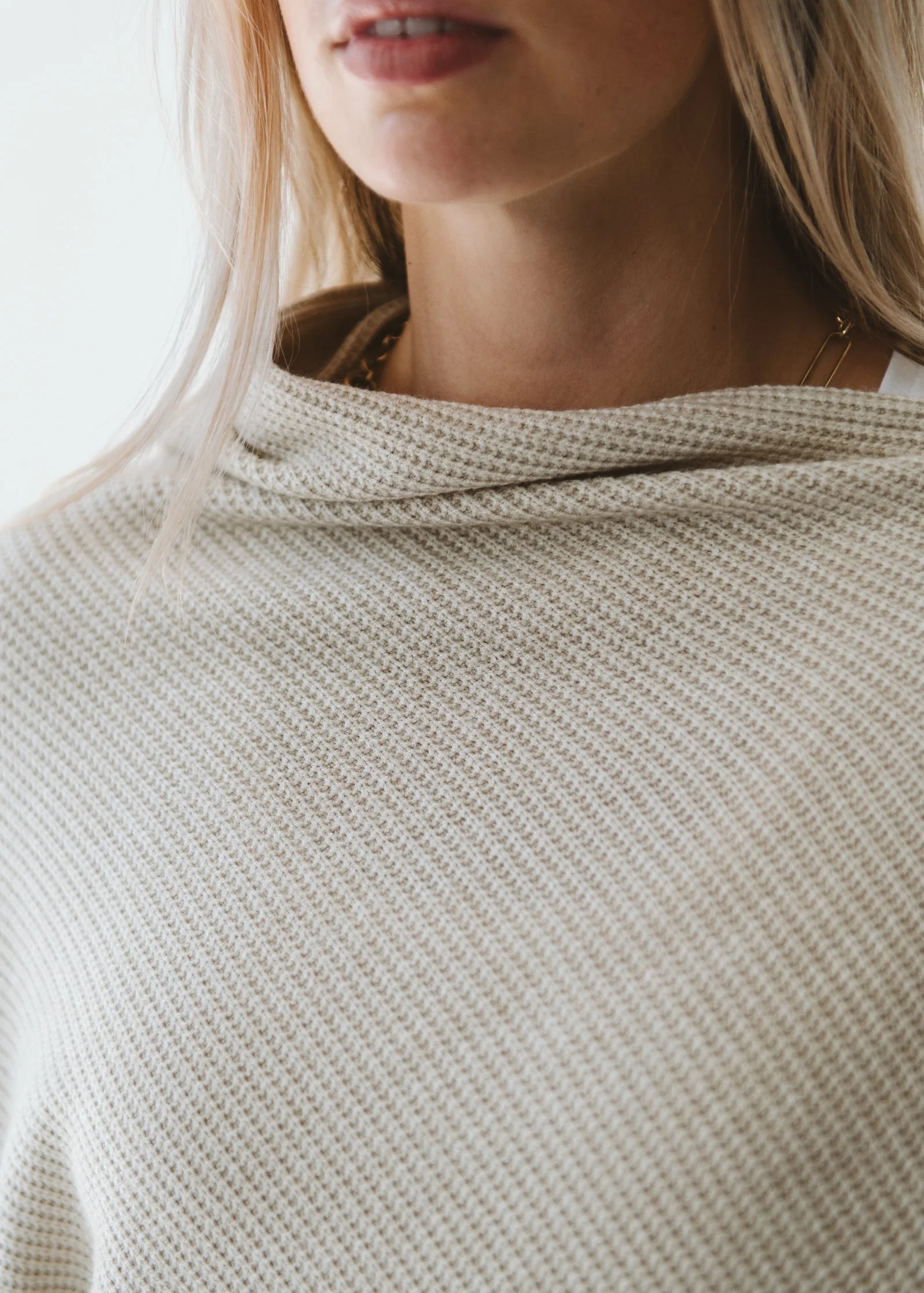 Cream Trinity poncho, cozy and stylish winter accessory, made in South Africa, perfect for cold weather outerwear.