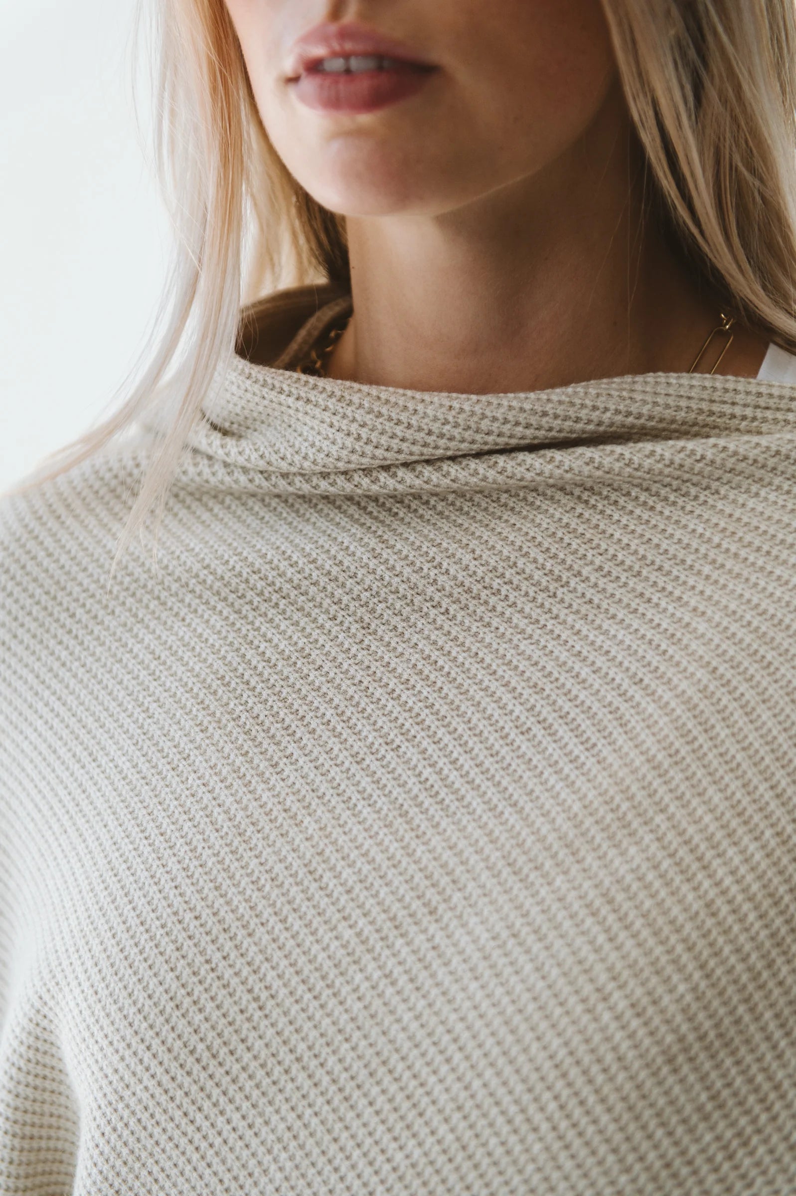 Cream Trinity poncho, cozy and stylish winter accessory, made in South Africa, perfect for cold weather outerwear.