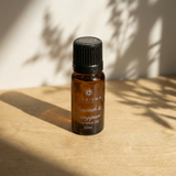 Charisma Candles hyacinth and frangipani fragrance oil in a clear bottle with a black cap, showcasing floral scent and elegant design.