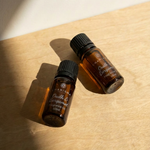 Charisma Candles Oudh & Bergamot fragrance oil in a glass bottle with a black cap, showcasing a luxurious aroma blend.