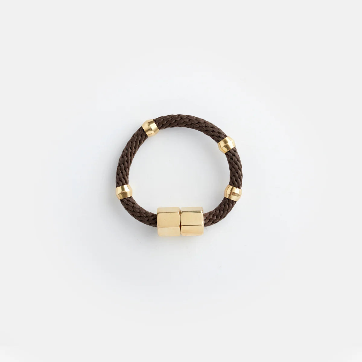 Pichulik Mer brown bracelet made of cord with intricate knot details, styled on a wrist for a natural, artisanal look.