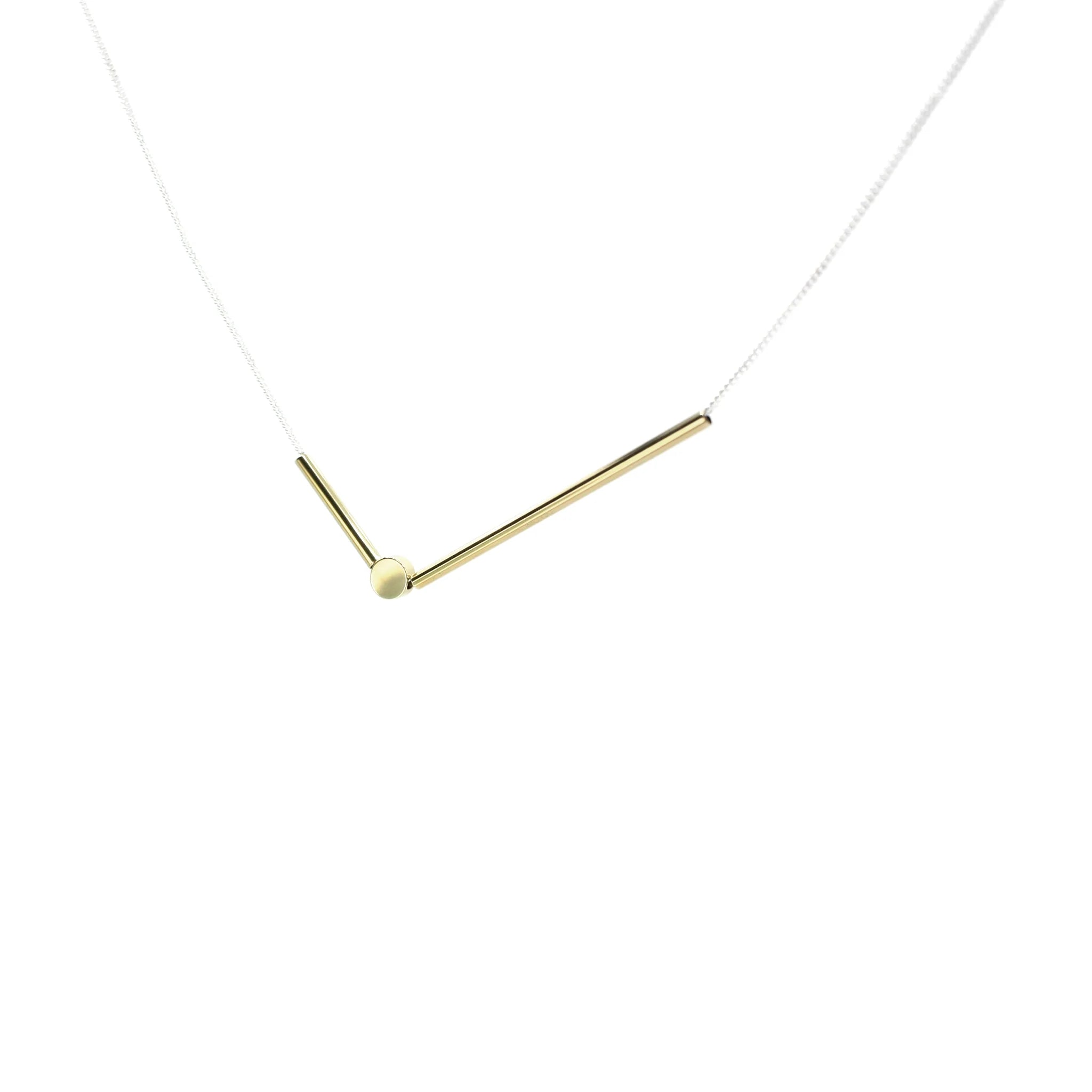 A Bird Named Frank Sticks & Stones Necklace with layered silver chains and unique pendant on a plain background.