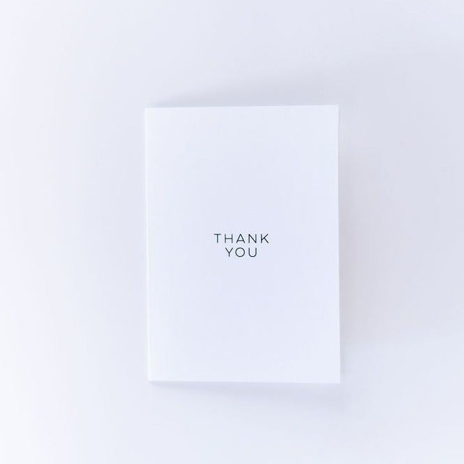 Close-up of Adele Catherine Thank You Plain graphic card featuring a simple, elegant design on a neutral background.